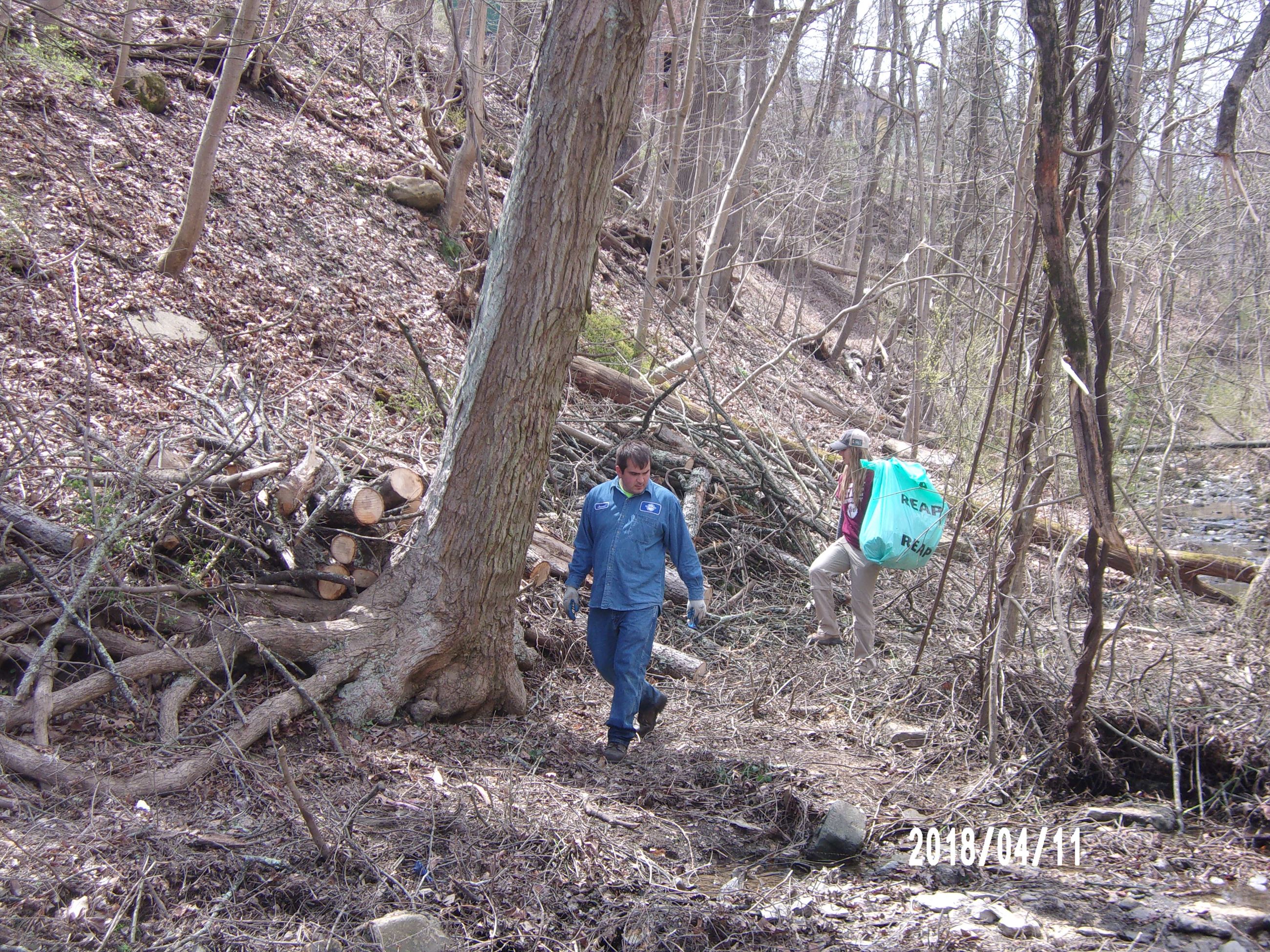 Man and Woman Carrying a Reap Bag